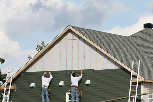 Professional Emergency Siding Repair technician working in Westwood, MA